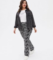 New Look Curves Black Zebra Print Jersey Flared Trousers